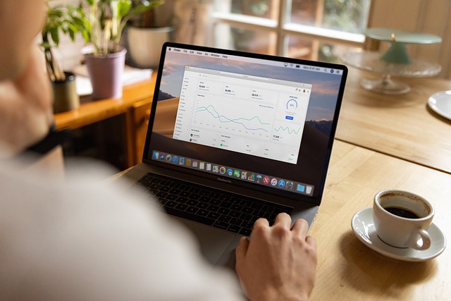 Laptop displaying graphs and charts
